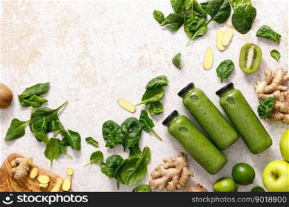 Smoothie. Healthy fresh raw detox spinach smoothie with green apple, kiwi and ginger in a bottles on a table. Healthy diet vegan food full of antioxidants. Top view