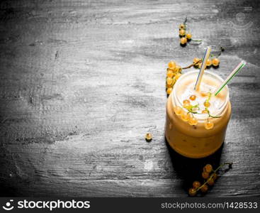 Smoothie made from white currants. On the black chalkboard. Smoothie made from white currants.