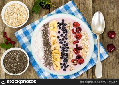 Smoothie with Blueberries, Chia Seeds on Brown Boards Studio Photo. Smoothie with Blueberries, Chia Seeds on Brown Boards