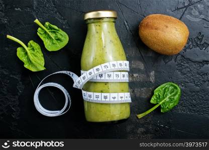 smoothie with spinach and kiwi in bottle