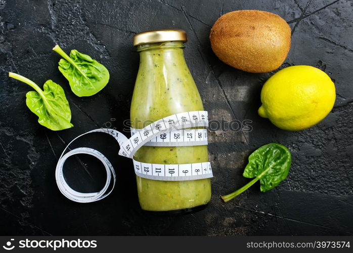 smoothie with spinach and kiwi in bottle