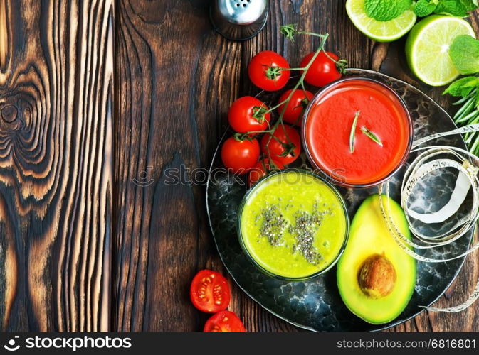 smoothies in glass and on a table