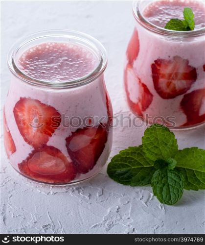 smoothies of fresh strawberries in a glass jar