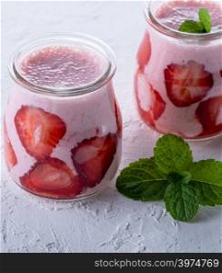 smoothies of fresh strawberries in a glass jar