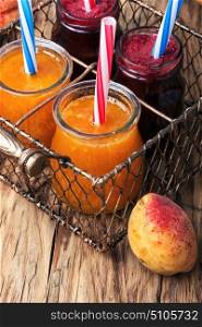 Smoothies with apricot and currant. Freshly blended smoothies with ripe apricot and currant berries