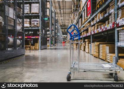 Smut Prakan ,Thailand - May 17,2018 : A cart in warehouse aisle in an IKEA store. IKEA is the world's largest furniture retailer.