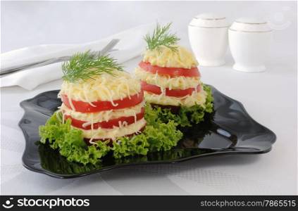 Snack bars of tomato under acute stuffed eggs with cheese