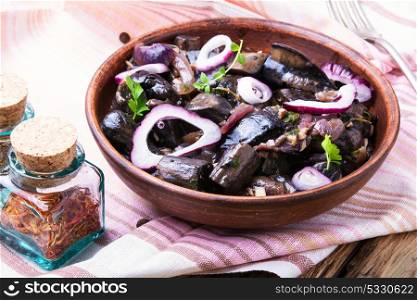 Snack from pickled mushrooms. Dish snack with pickled mushrooms with spices.Traditional Russian Food
