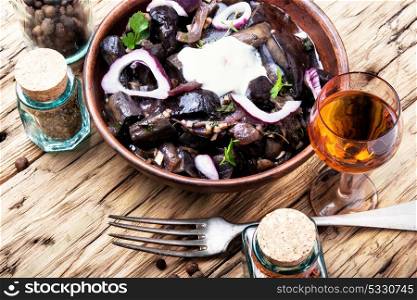 Snack from salted mushrooms. Salted pickled forest mushrooms, appetizer for strong alcohol