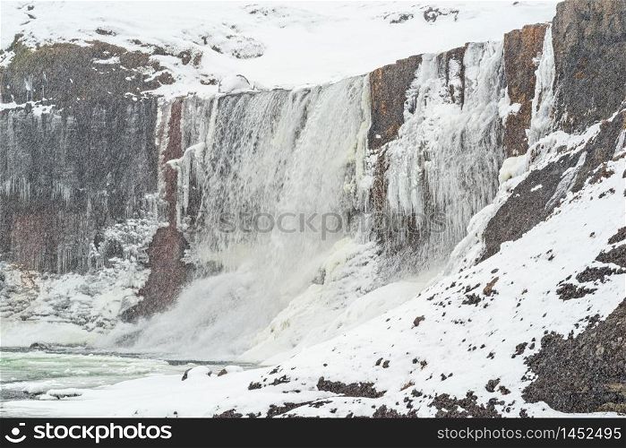 Snaedufoss waterfall during a snowing winter day, Iceland. Snaedufoss waterfall, Iceland