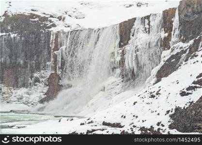 Snaedufoss waterfall during a snowing winter day, Iceland. Snaedufoss waterfall, Iceland