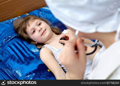 "Snapshot on the theme "medicine". Doctor examines a girl."