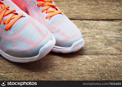Sneakers with wooden background