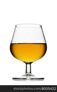Snifter glass of brandy isolated over white background