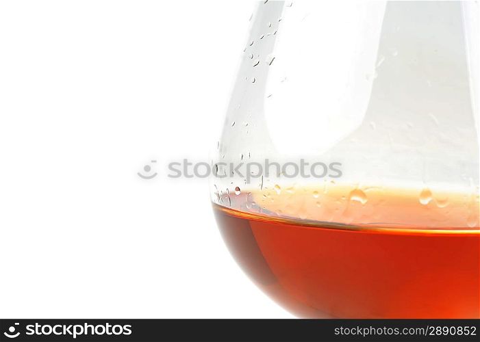 snifter of brandy in elegant glass. light background