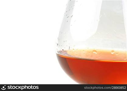 snifter of brandy in elegant glass. light background