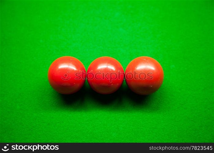 Snooker balls, three balls on the table. Snooker balls in the middle of the picture.