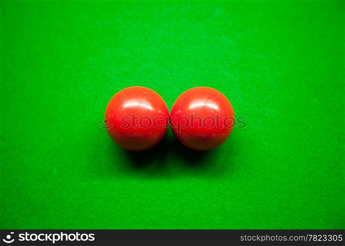 Snooker balls, two balls on the table. Snooker balls in the middle of the picture.