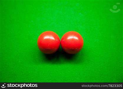 Snooker balls, two balls on the table. Snooker balls in the middle of the picture.