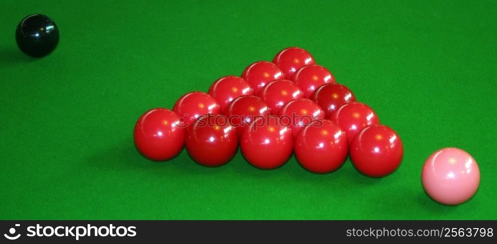 Snooker table with the red balls pink and black ball.