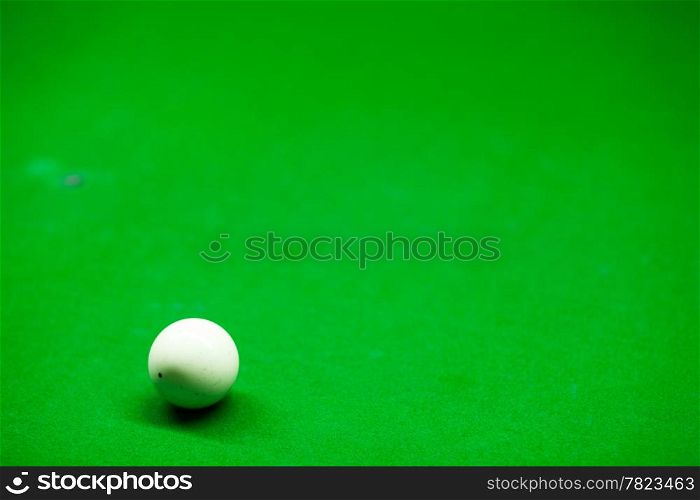 Snooker white. Placed on a snooker table. The white ball to shoot colored balls in order to score.
