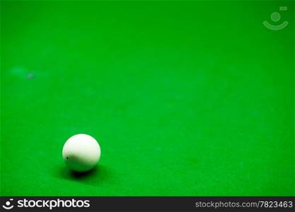 Snooker white. Placed on a snooker table. The white ball to shoot colored balls in order to score.