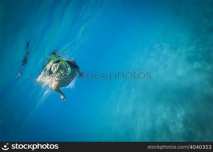 Snorkeler swimming underwater