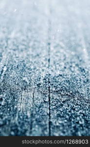 snow and ice on the wooden table in winter days