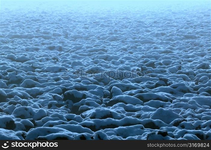 Snow Blanketing Blue Rocks