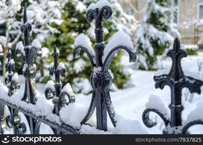 Snow cover rusty old fence closeup view