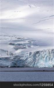 Snow covered glacier mountain in the Antarctic sea