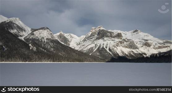 Snow covered landscape with mountains in winter, Emerald Lake, Field, British Columbia, Canada
