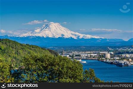 Snow-covered Mount Rainier towers over the Port Of Tacoma.