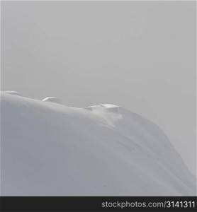 Snow covered mountain surrounded with fog, Whistler, British Columbia, Canada