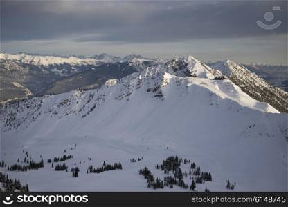 Snow covered mountains with valley in winter, Kicking Horse Mountain Resort, Golden, British Columbia, Canada