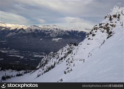 Snow covered valley with mountains in winter, Kicking Horse Mountain Resort, Golden, British Columbia, Canada