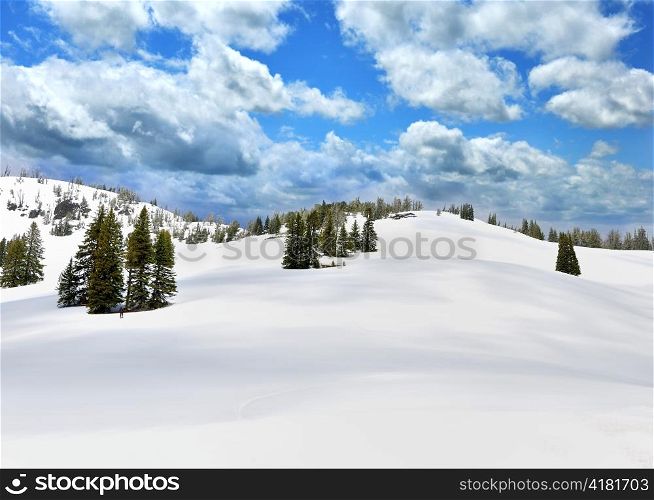 Snow In A High Mountains And A Blue Sky