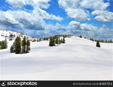 Snow In A High Mountains And A Blue Sky