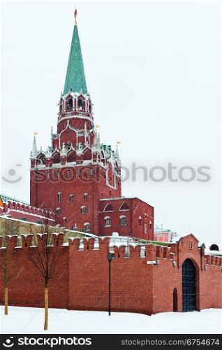 snow in Moscow - view of Kremlin Troitskaya Tower in winter snowing day
