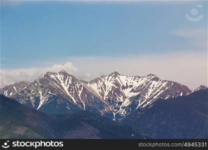 Snow melting on the mountains peak. Spring in Slovakia, Tatras mountains.