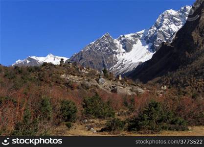 Snow mountain and buddhist stupas in Nepal
