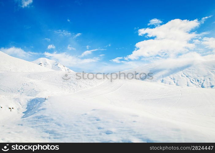 Snow mountains on bright winter day