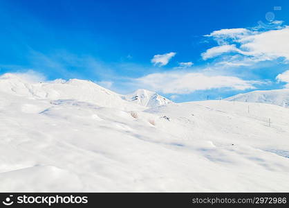 Snow mountains on bright winter day