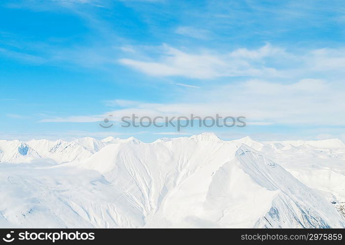 Snow mountains on bright winter day