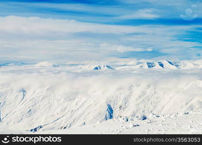 Snow mountains on bright winter day