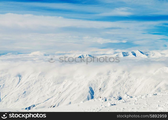 Snow mountains on bright winter day