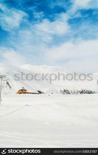 Snow mountains on bright winter day