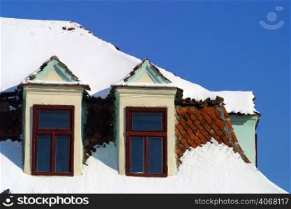 Snow on a rooftop, Brasov, Transylvania, Romania.