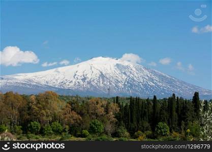 snow on mountain etna, big italian volcano, seen from the plain