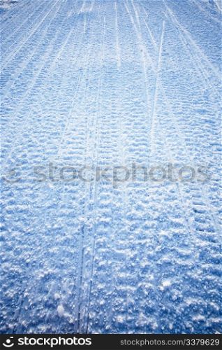 Snow texture background from snowmobile tracks